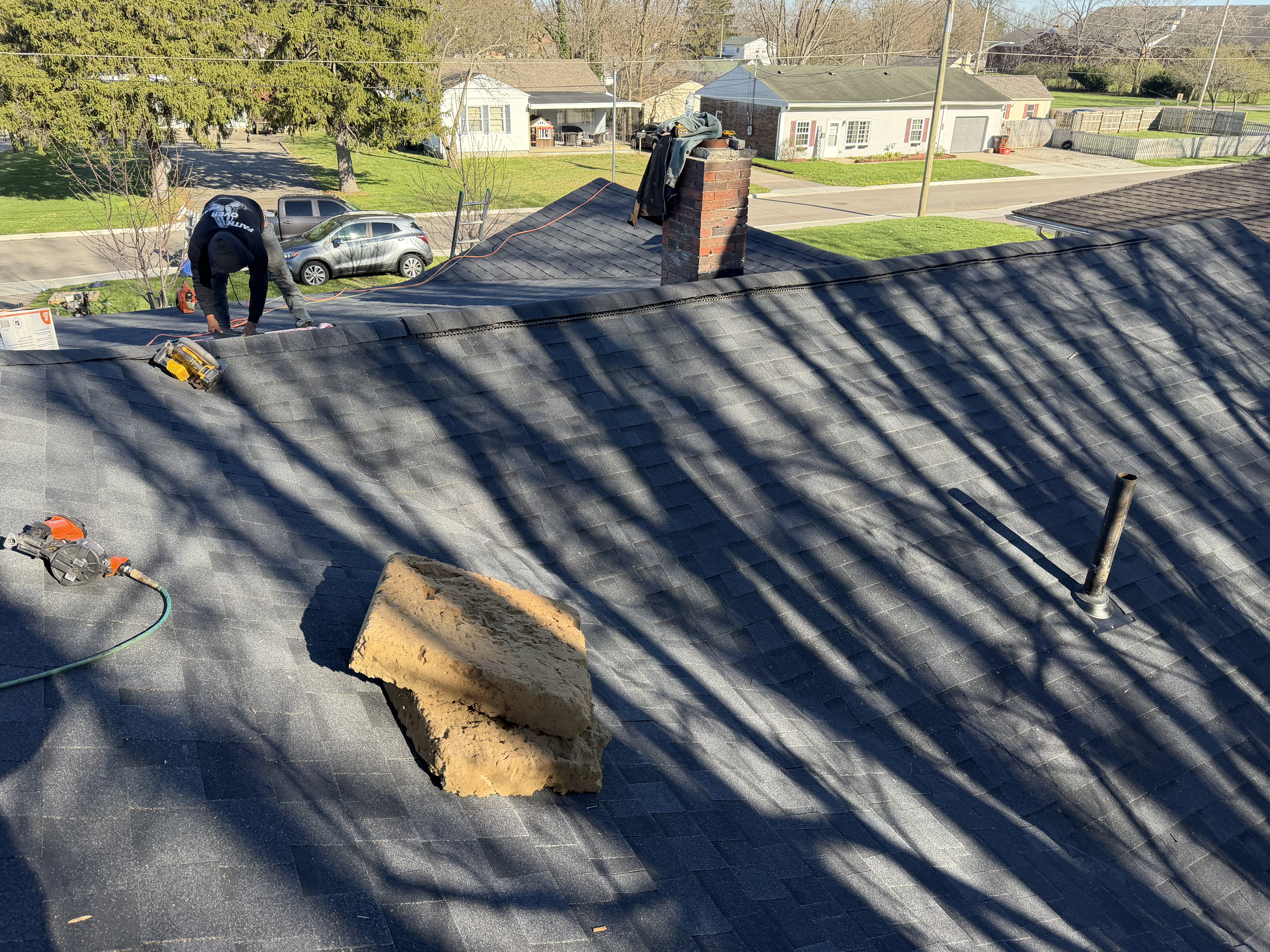 Residential asphalt roof after repair work