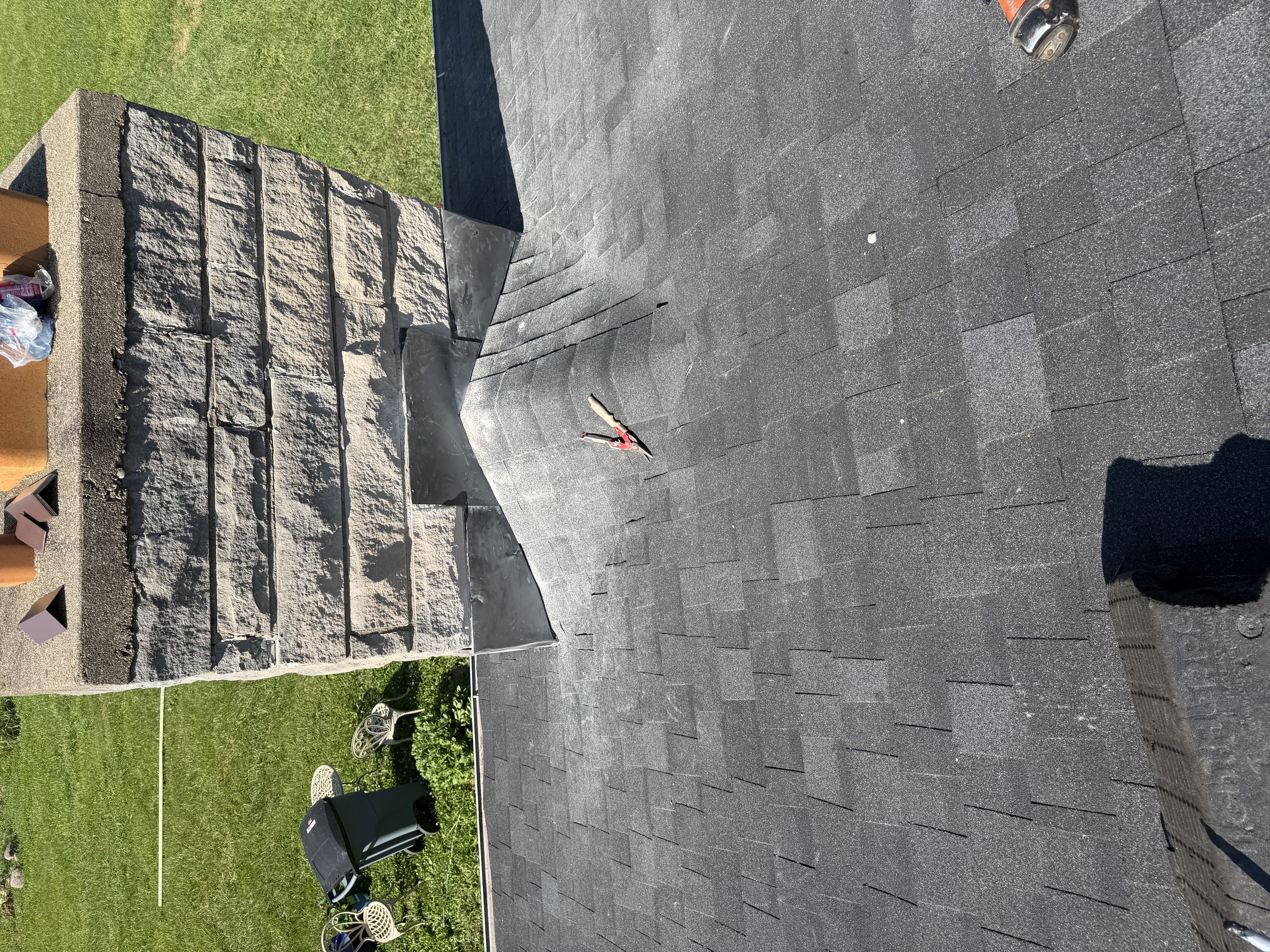 Finished roof penetration flashing after skylight work
