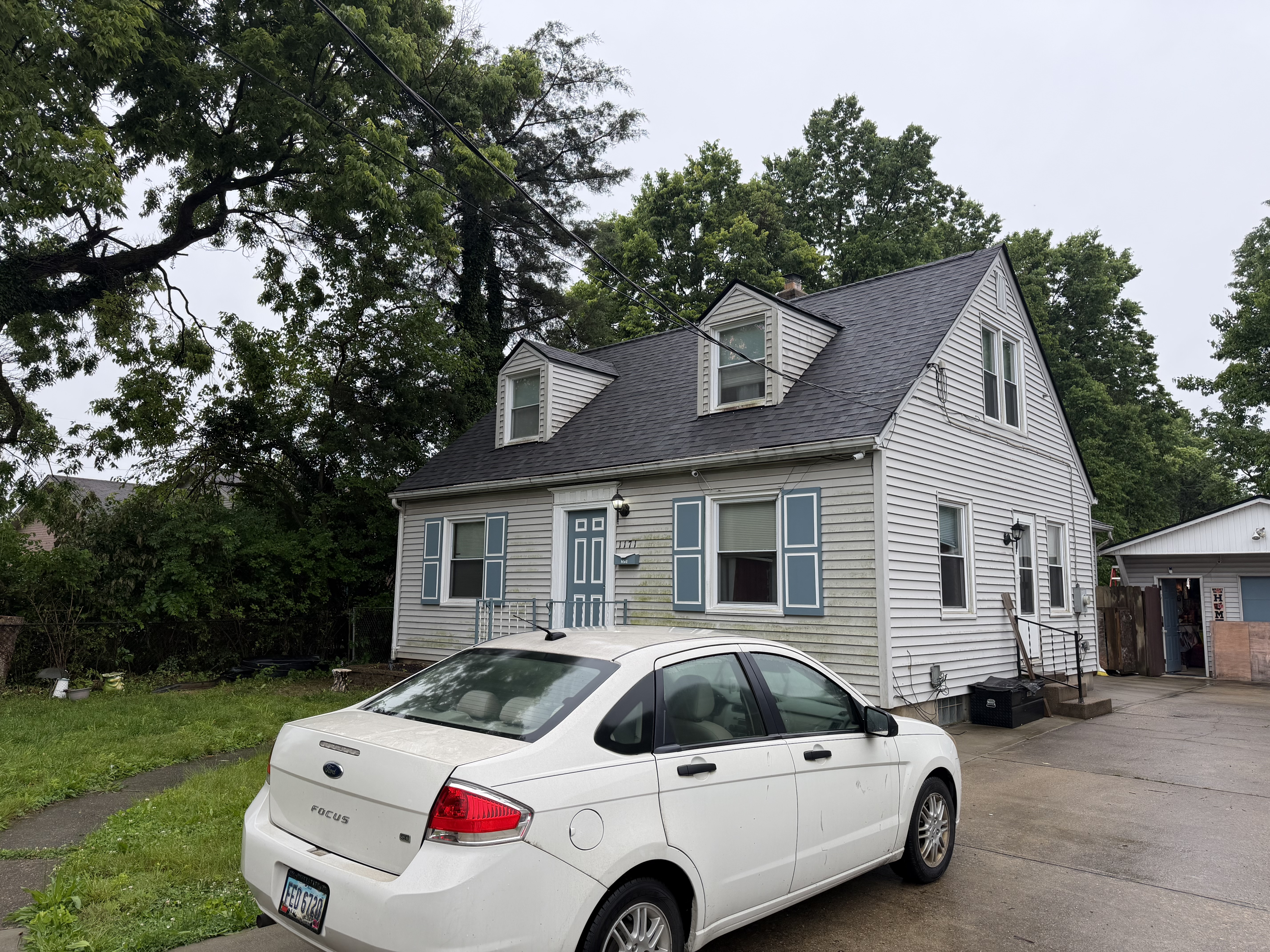 Residential home with updated windows, trim, and siding