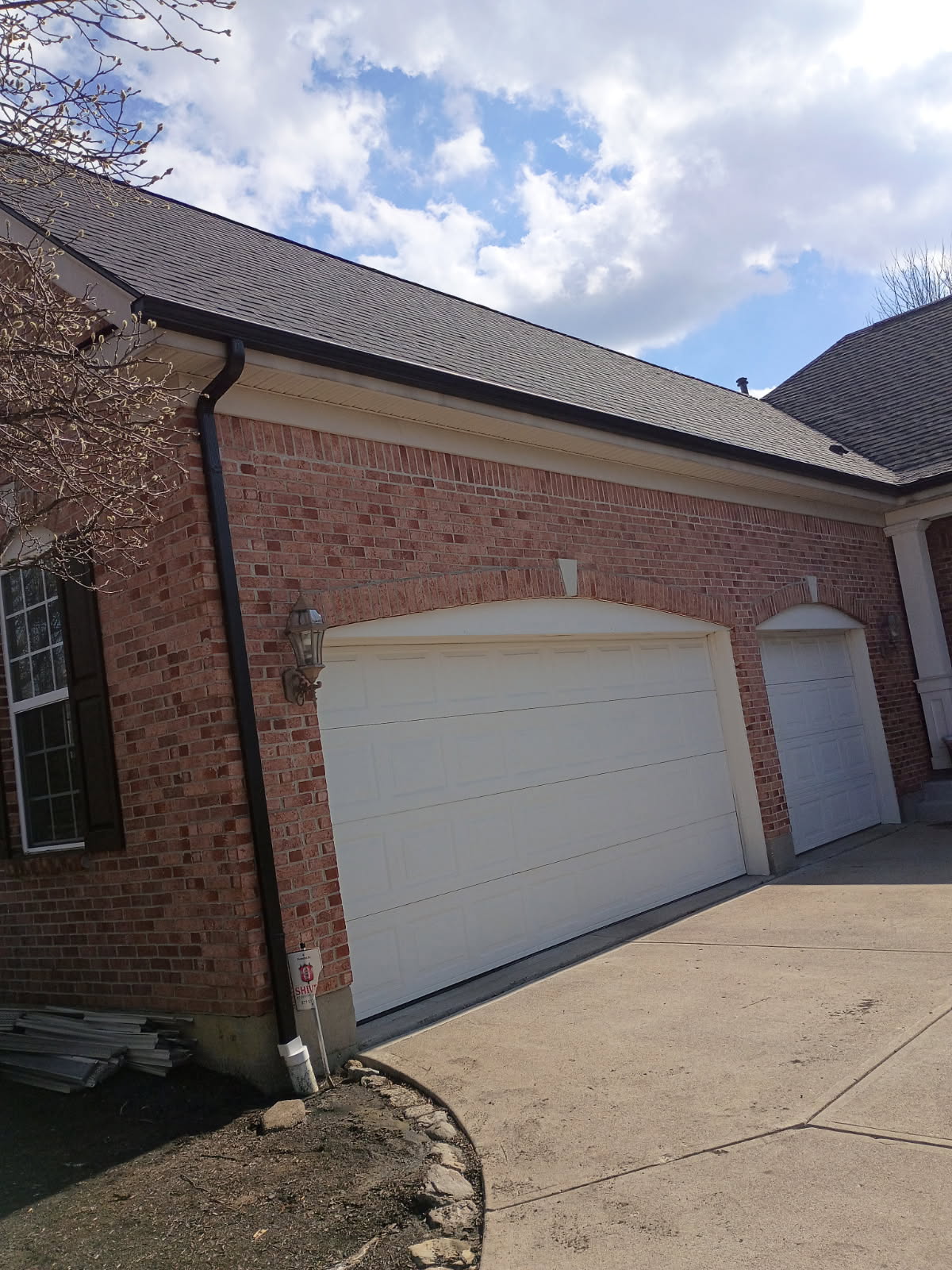 Completed gutter replacement on a brick home