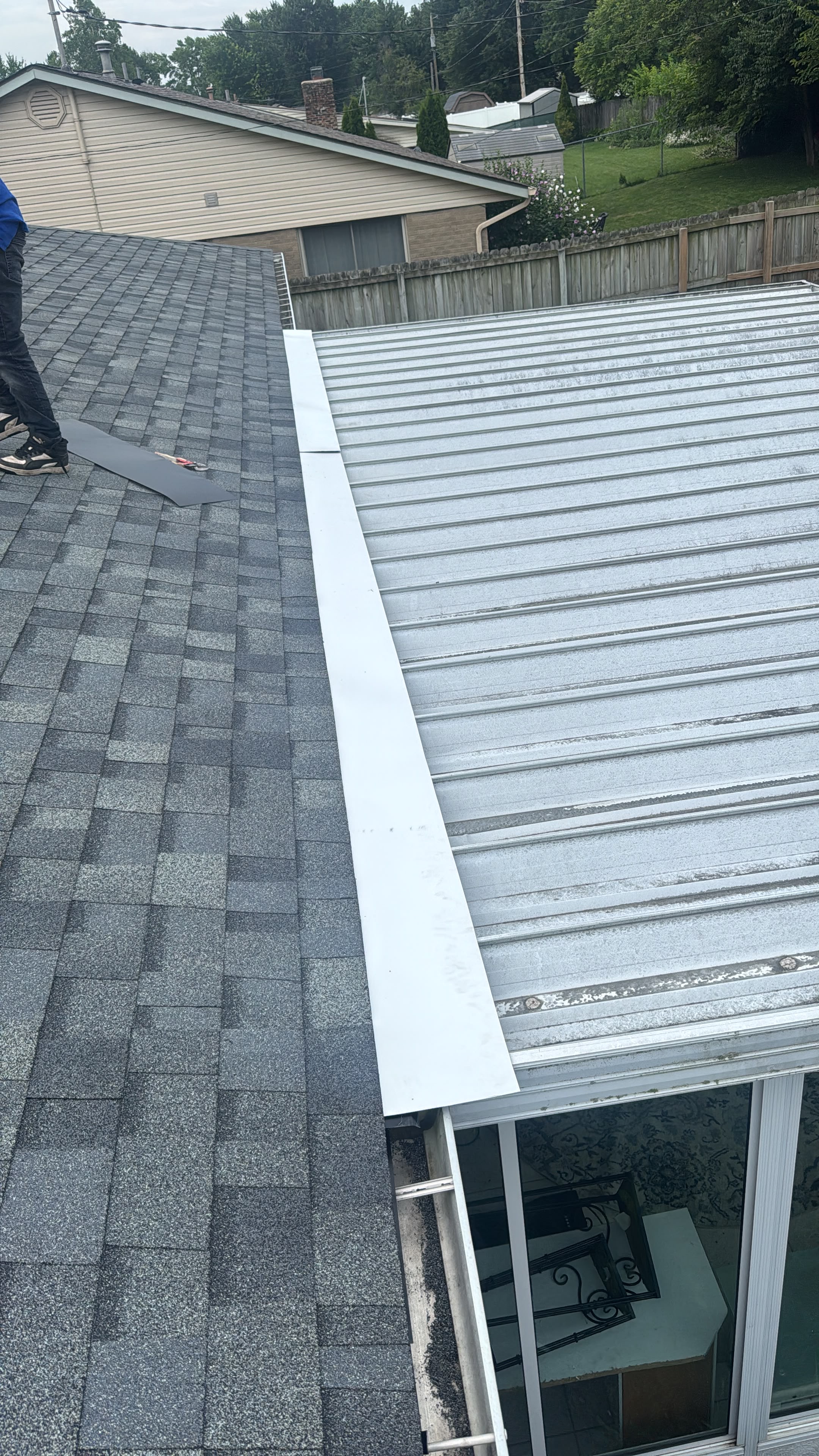 Roof eave transition where ice dams form and get repaired