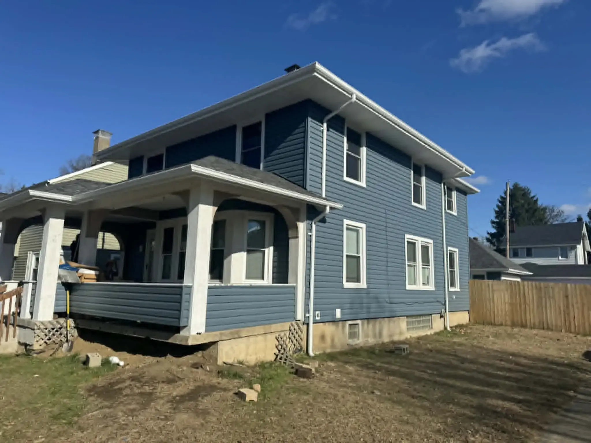 Newly installed siding panels and trim on a residential home exterior