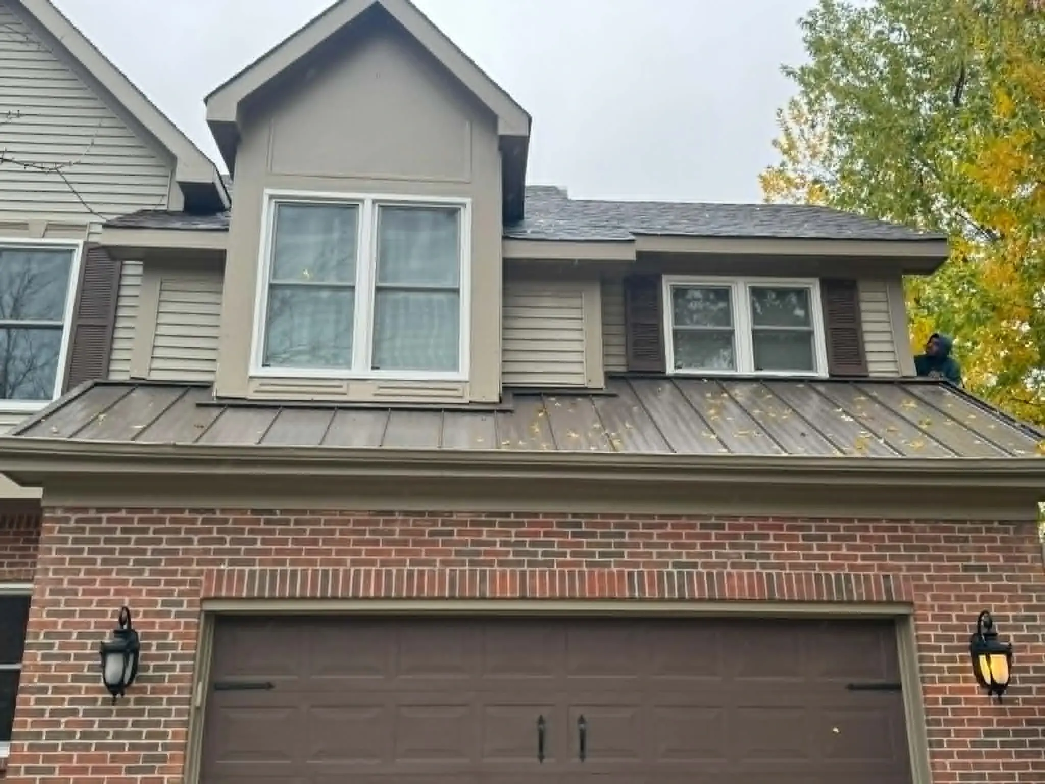 Updated home facade after exterior remodeling and siding work