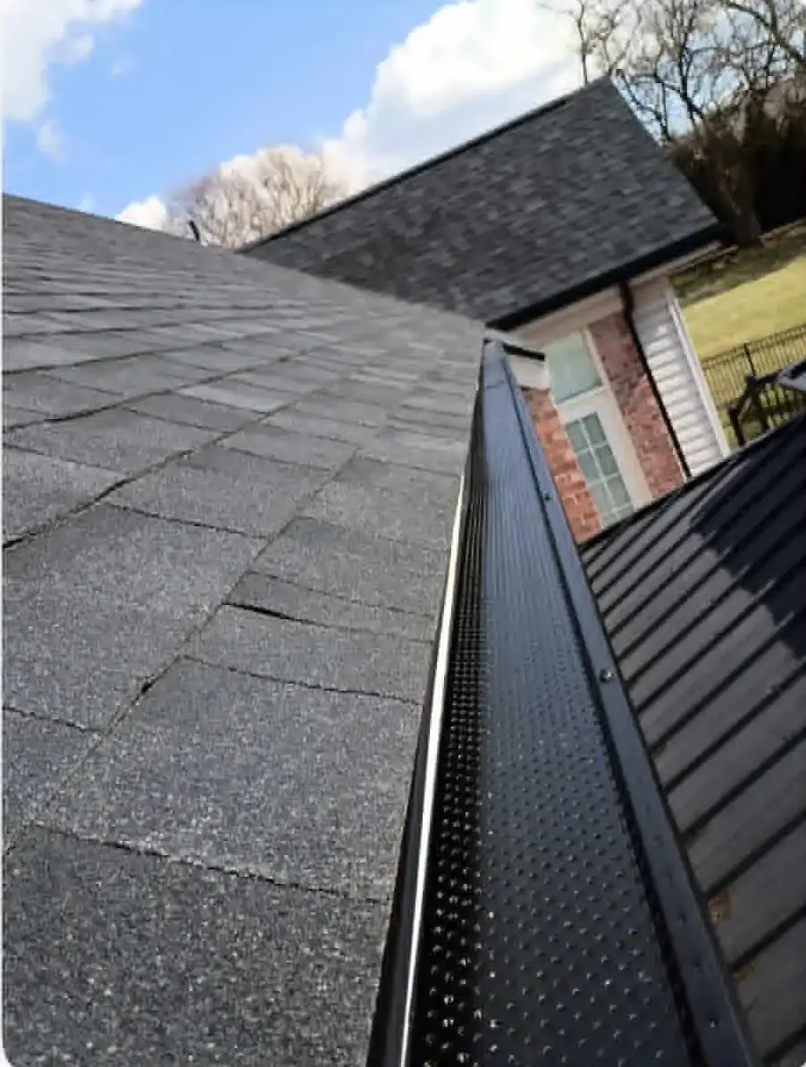 Gutter and roofline detail on a completed home with proper water drainage