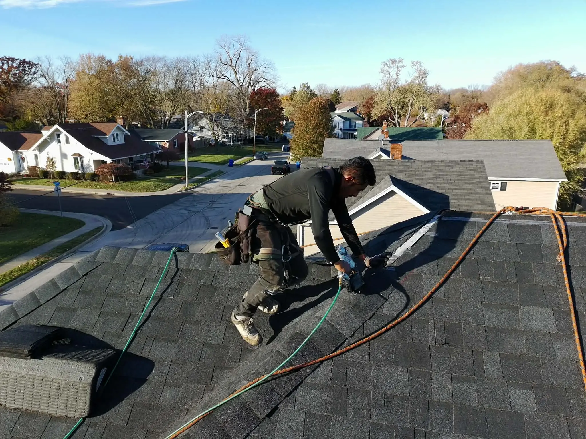 Roofing nail gun used for fast, precise shingle fastening on a replacement job
