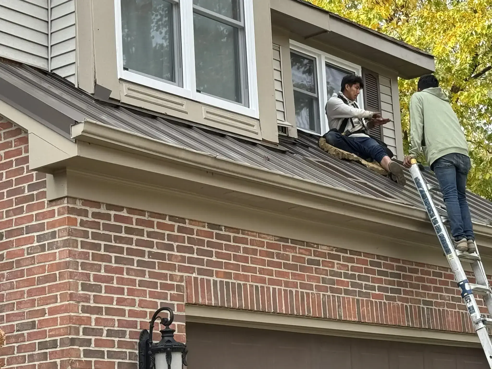 Homeowner and contractor reviewing plans for an interior and exterior remodel