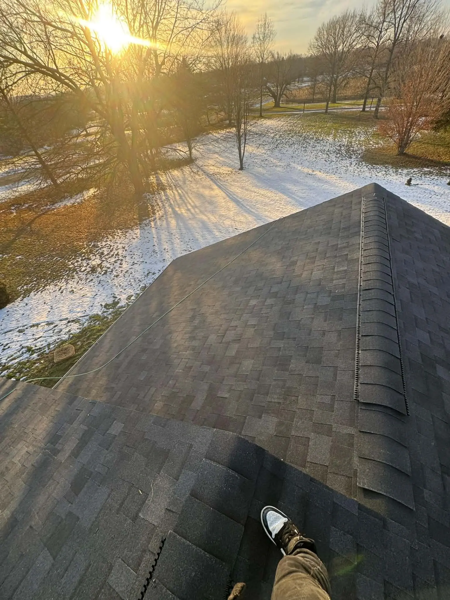 Close-up of finished shingle texture and color on a winter-season roof install