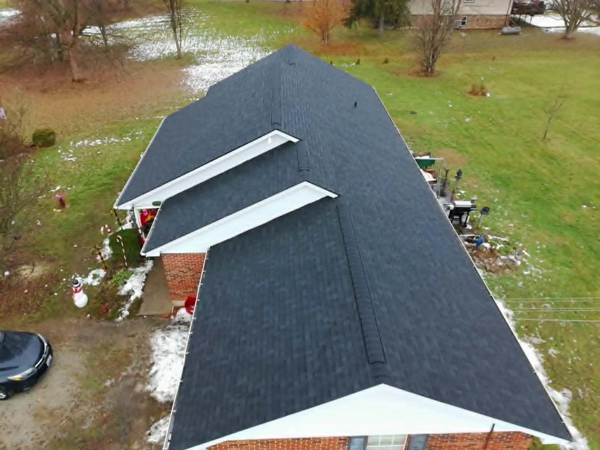 White fascia board and seamless gutter profile on a finished home