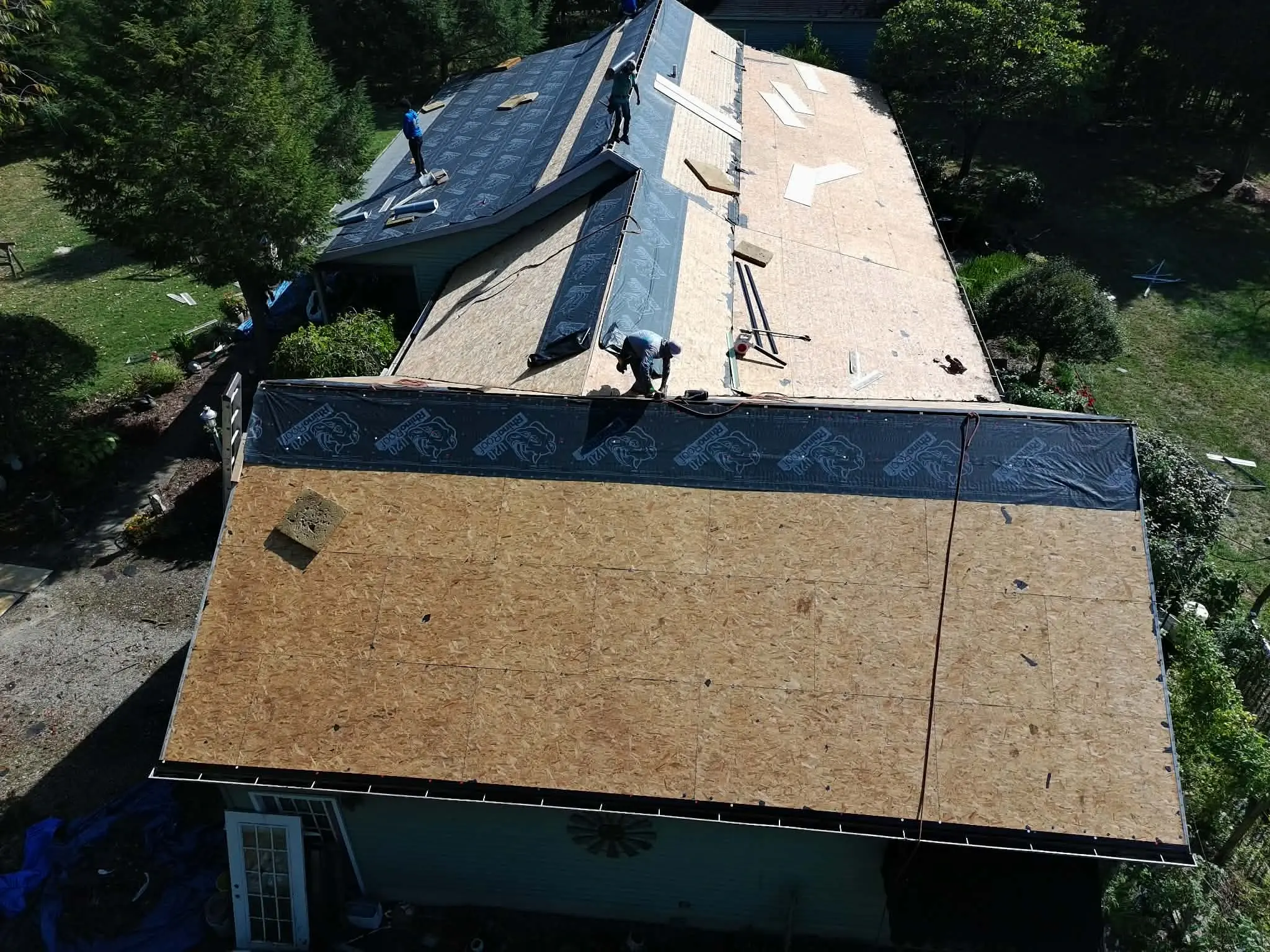 Aging wood shake roof before replacement with modern asphalt shingles